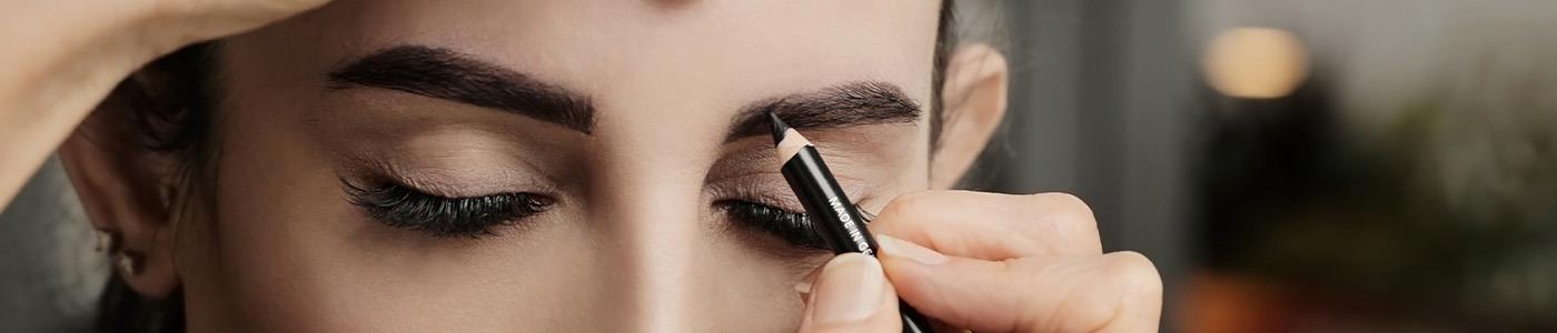 woman eyebrow being filled in