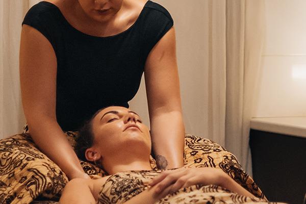 woman massaging shoulders