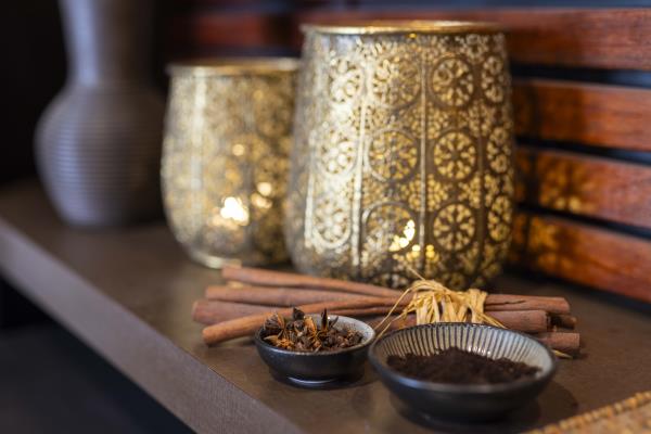 Day spa setting of bowls of spice and glowing lanterns